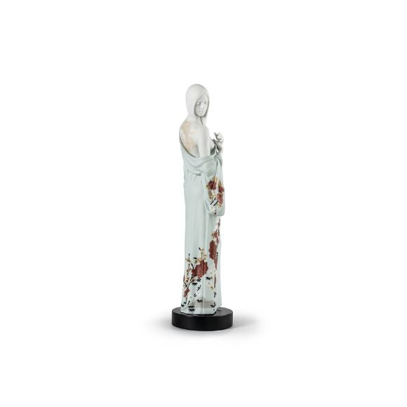 Woman porcelain sculpture, an artistic and timeless centerpiece. Figurine sculpture.